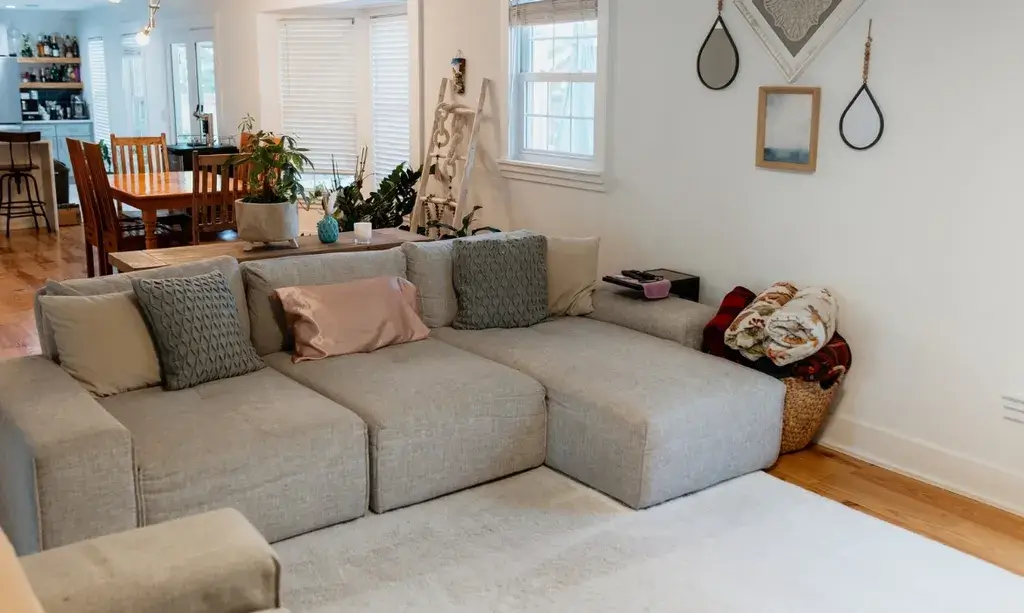 Clean and organized living room maintained by a local cleaning company in Charleston